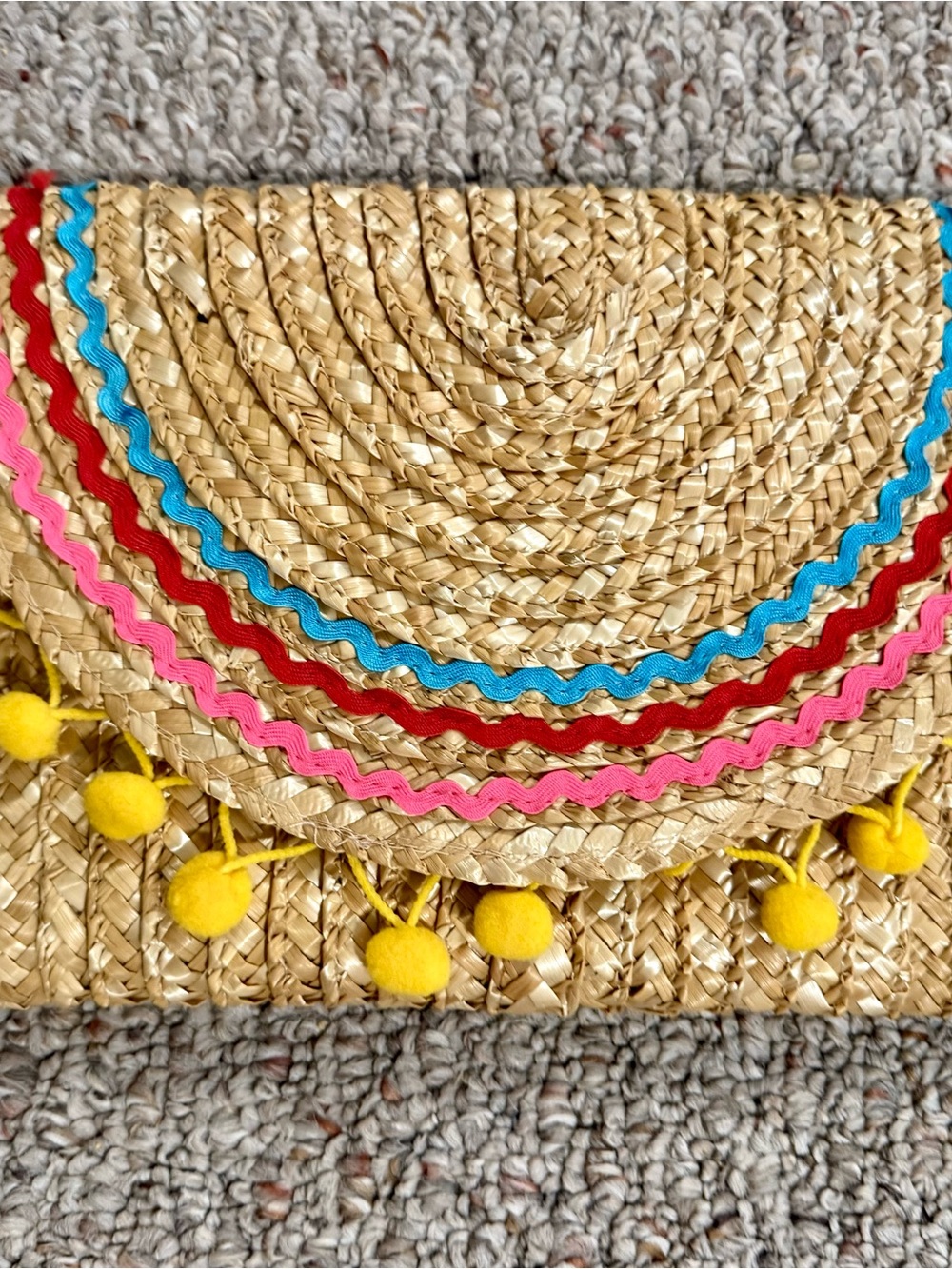 Shiraleah Straw Phone Case with Pink, Red, Blue Trim and Yellow Pom Poms